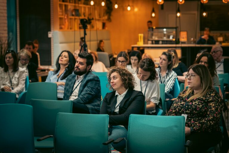 Guests seated at an event in the Workin space